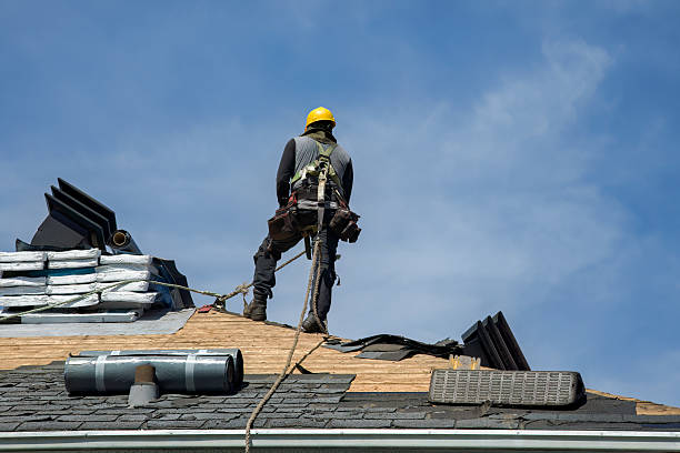 Professional Roofing technician working in Idlewild, MI